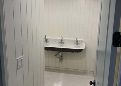 wash room with shiplap walls